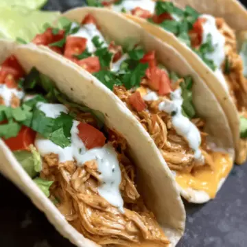 Slow Cooker Queso Chicken Tacos